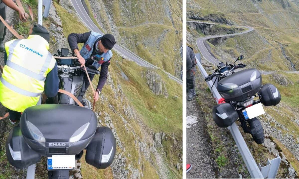 VIDEO Motociclist american, suspendat după un parapet pe Transfăgărășan - A derapat pe o pată de ulei