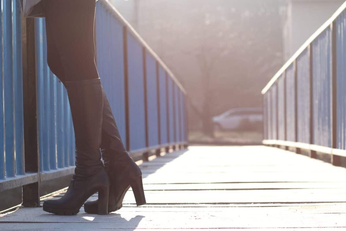 woman standing on bridge