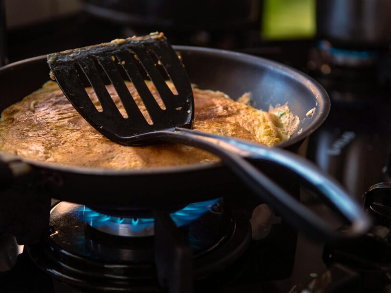 black spatula on black frying pan