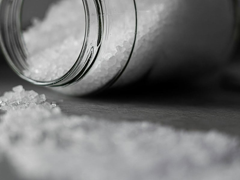 selective focus photo of salt in glass jar