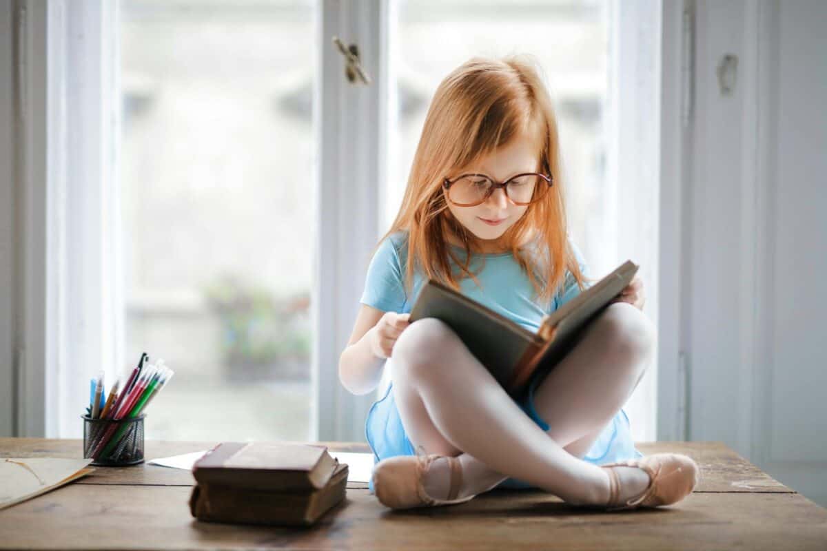 photo of girl reading book