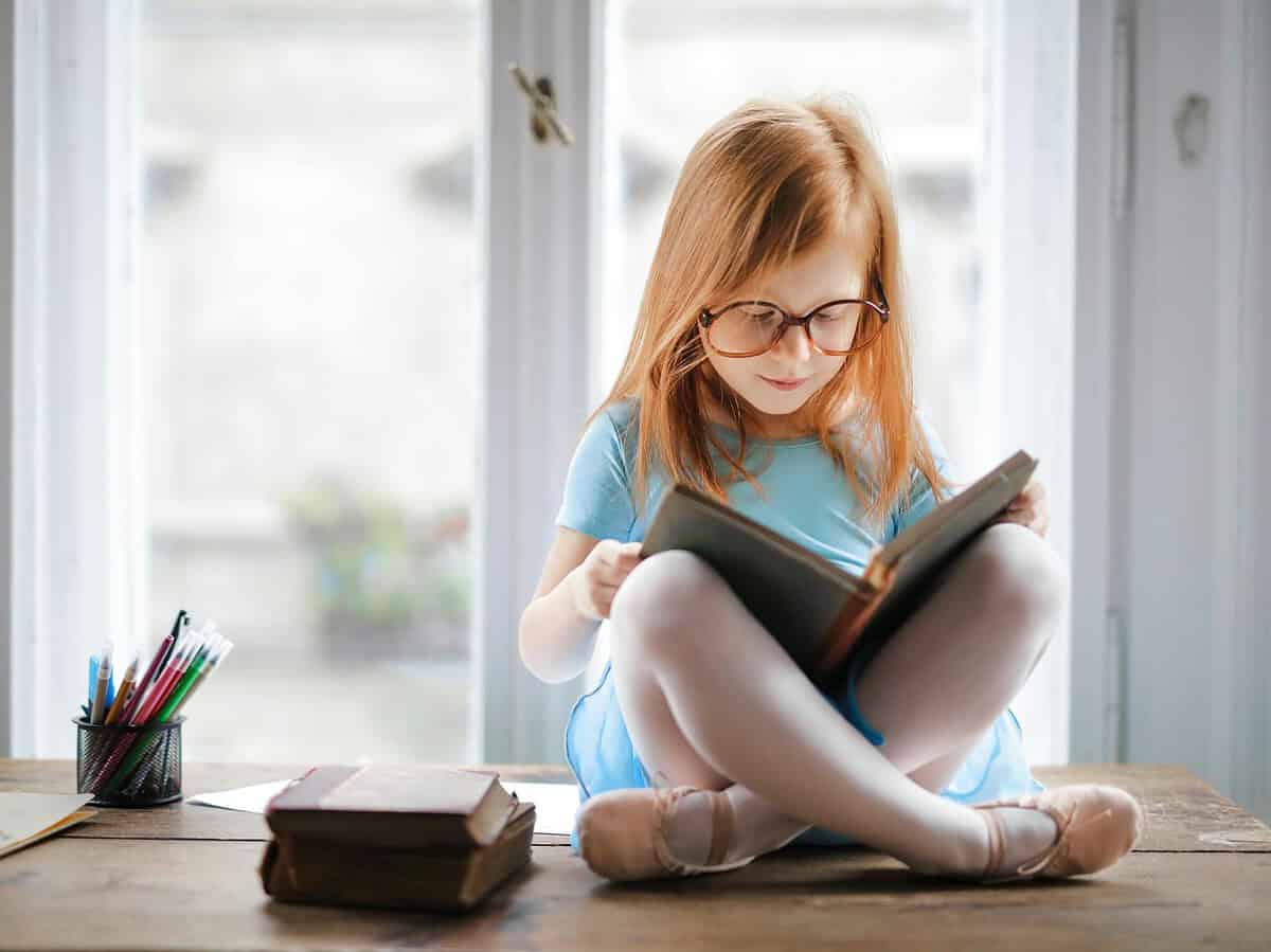 photo of girl reading book